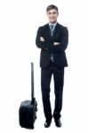 Young Business Man With Trolley Bag Stock Photo