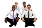 Business Team Sitting On Floor Stock Photo