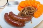 Beef Sausages Cooked On Iron Skillet Stock Photo