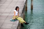 Girl With Guitar On Wooden Bridge Stock Photo