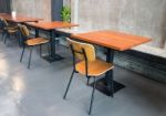 Empty Wooden Table In Grey Room Stock Photo