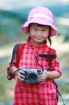 Asian Girl With Digital Camera In Beautiful Outdoor Stock Photo