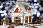 Gingerbread House And Snowman Stock Photo