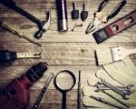 Set Of Tools Over A Wood Background Stock Photo