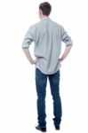 Back Pose Of Smart Young Guy Stock Photo