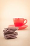 Red Mug Of Hot Coffee And Chocolate Pieces Stock Photo