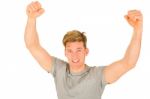 Young Man With Arms Up Stock Photo