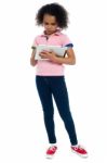 Young Girl Super Busy In Operating New Tablet Device Stock Photo