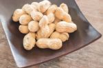 Salted Peanuts On Wooden Bowl Stock Photo