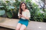 Portrait Of Thai Student University Beautiful Girl Using Her Smart Phone Stock Photo