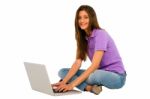 Smiling Teenage Girl Using Laptop Stock Photo