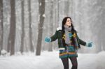 Beautiful Young Woman In A Sweater On A Winter Walk In A Park Stock Photo