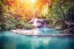 Thailand Waterfall With Sunbeam In Kanjanaburi (erawan Waterfall Stock Photo