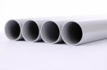 Steel Pipes Cut Front Focus On White Floor Stock Photo