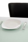 Plates On Dinning Table Stock Photo