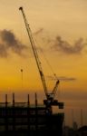 Crane Of Building Construction On Dusky Sky Stock Photo