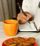 Making Notes In An Organizer Stock Photo