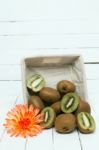 Tasty Kiwi Fruits Isolated On A White Wooden Background Stock Photo