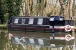 Narrow Boat On The River Wey Navigations Canal Stock Photo