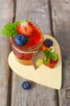 Red And Yellow Jelly Served With Fruit Stock Photo