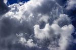 White Clouds In The Bright Blue Sky Stock Photo