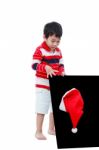 Little Boy Looking Santa Hat With The Blackboard ,isolated On White Stock Photo