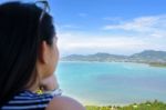 Woman Tourist Watching The Ocean In Phuket, Thailand Stock Photo