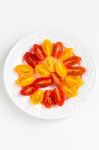 Cherry Tomatoes On White Plate Stock Photo