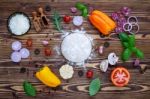 Raw Dough With Ingredients For Homemade Pizza On Shabby Wooden B Stock Photo