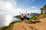 Two Girls Mother And Daughter Jumping Stock Photo