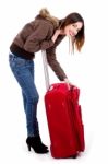 Young Lady Unzipping Her Bag Stock Photo