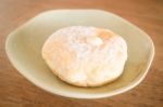 Cream Donut On Vintage Background Stock Photo