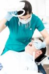 Female Dentist Doing Teeth Checkup Stock Photo