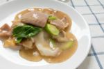 Rad Na, Famous Thai Chinese Style Wide Rice Noodle Dish With Tasty Tender Pork With Thick Gravy Sauce. Close Up Stock Photo