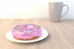 Pink Doughnut On Wood Table Stock Photo