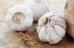 Garlic On Sackcloth Stock Photo