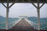 Wooden White Bridge Into The Sea Stock Photo