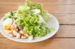 Homemade Salad Serving On Wooden Background Stock Photo