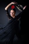 Young Flamenco Dancer In Beautiful Dress On Black Background Stock Photo