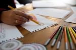 Young Women Working As Fashion Designer Drawing Sketches For Clo Stock Photo