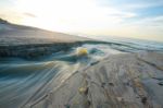 Sand Beach And Lake In The Sunrise Stock Photo