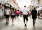 Blurred People Walking On The Street Stock Photo