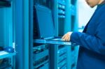 Man Fix Server Network In Data Center Room Stock Photo