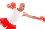 Male Boxer In Pose To Punch Hard Stock Photo