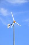 White Windmill With Rudder Stock Photo