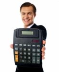 Businessman Showing Calculator Stock Photo