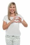 I Am In Love. Girl Making Heart With Fingers Stock Photo