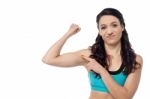 Sporty Woman Showing  Her Biceps Stock Photo