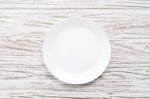 Empty Plate On White Wooden Table Background Flat Lay Stock Photo