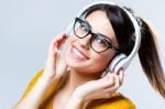 Beautiful Brunette Woman Listening To Music Stock Photo